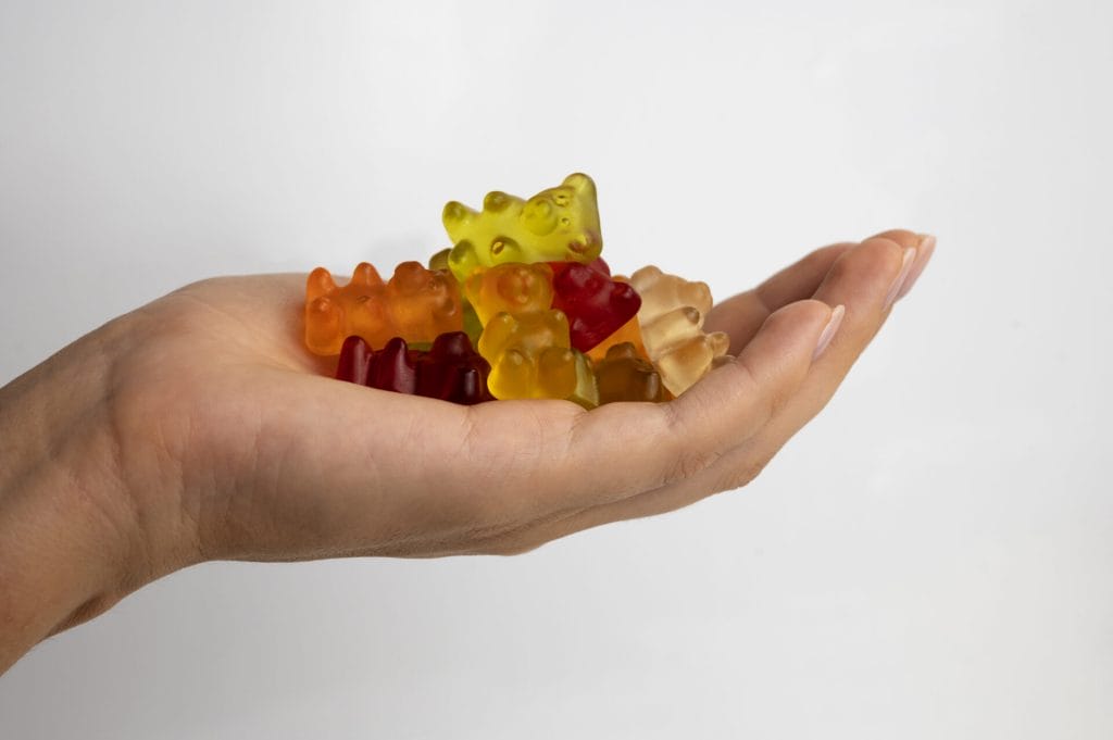 hand holding bear gummies
